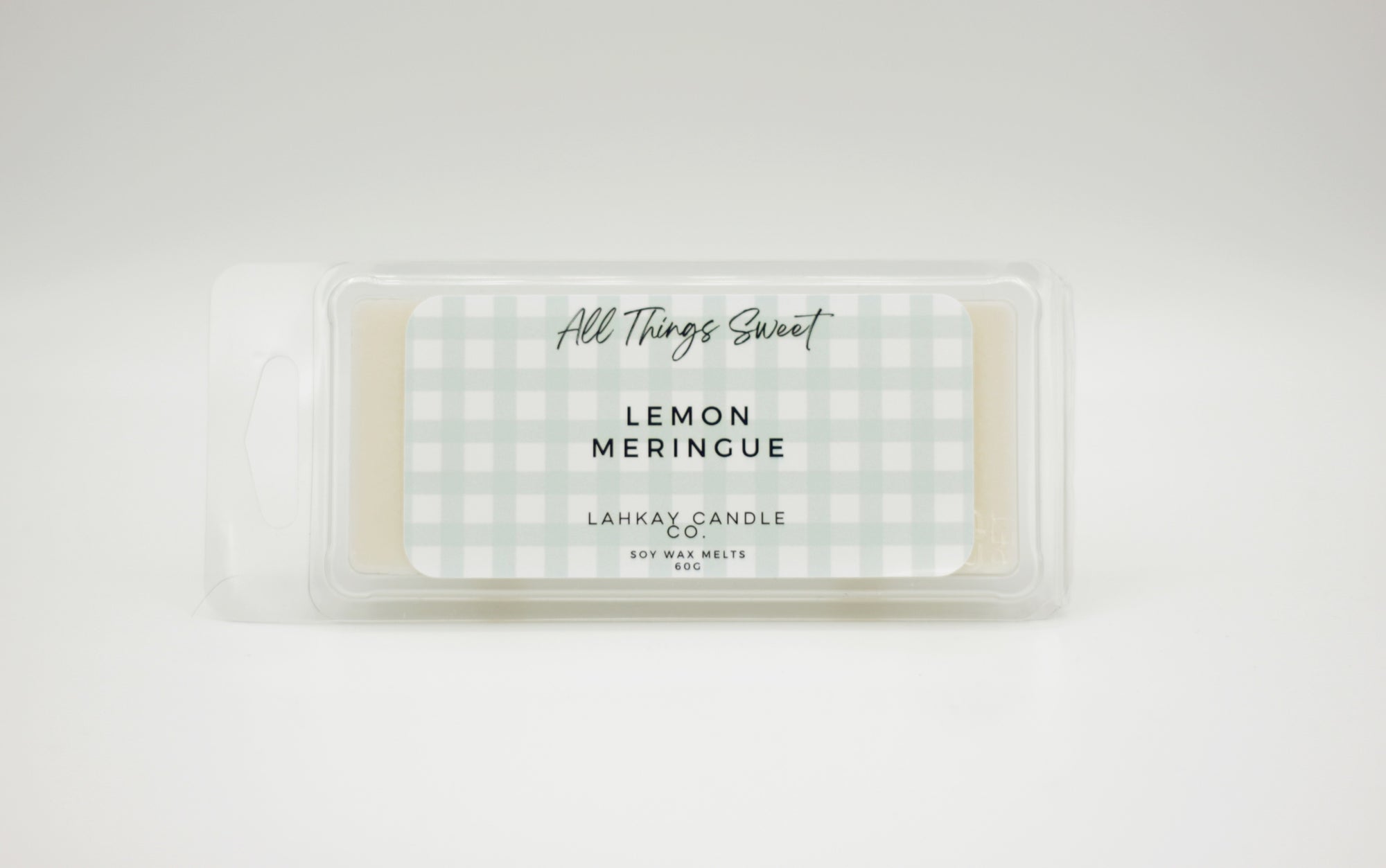 soy wax melt packaging with All Things Sweet' and Lemon Merinque fragrance text on a white background