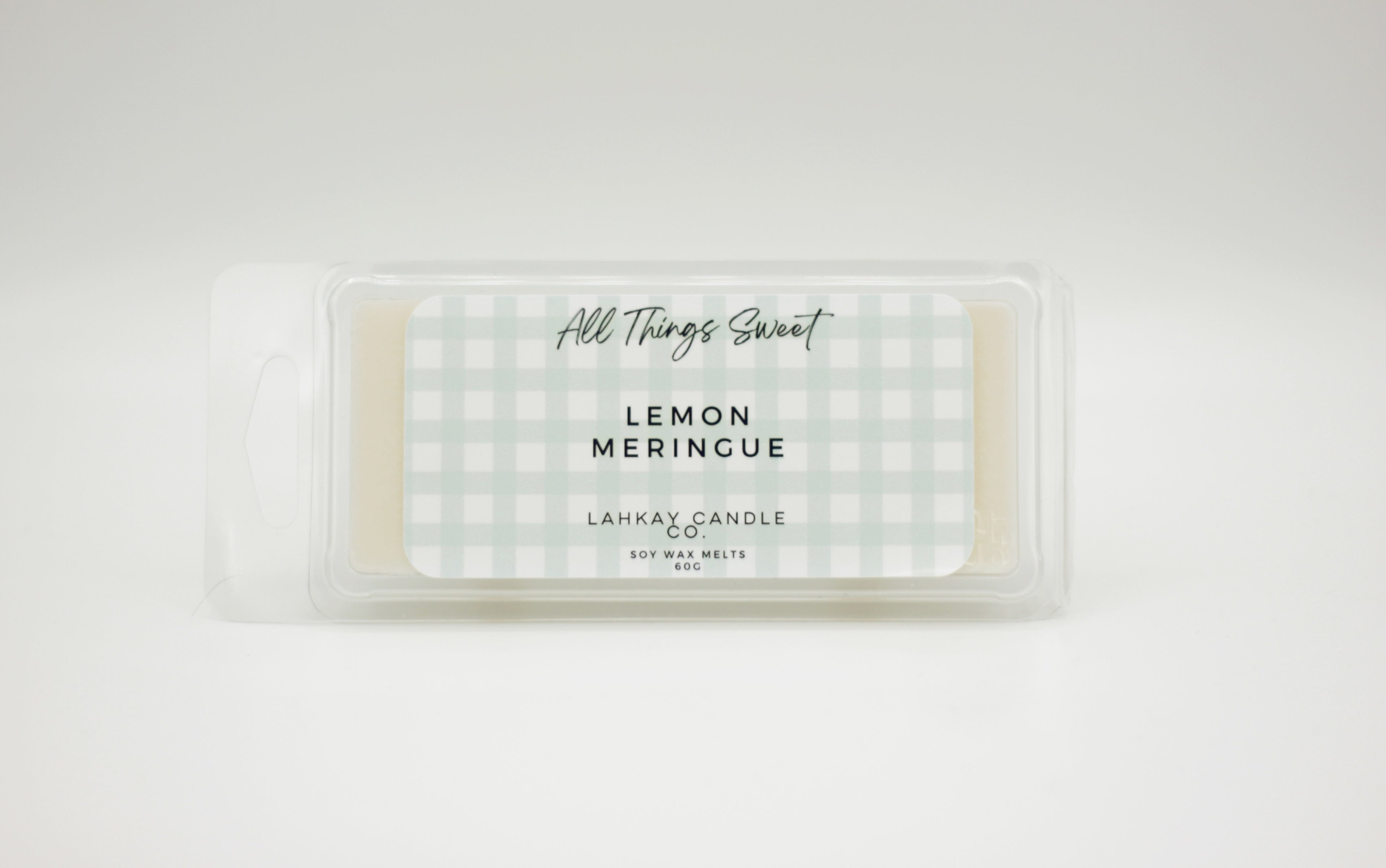 soy wax melt packaging with All Things Sweet' and Lemon Merinque fragrance text on a white background